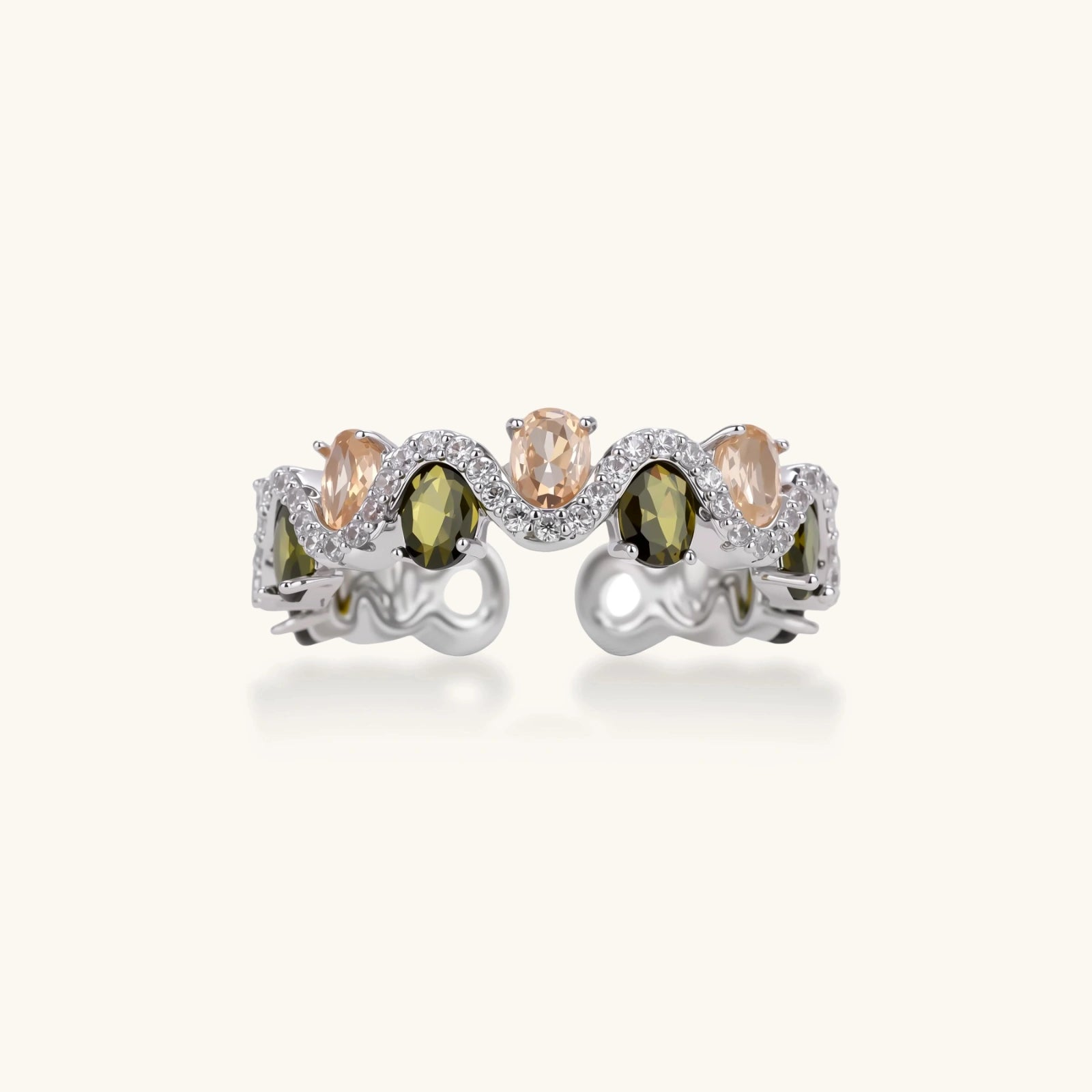 Adjustable copper ring with platinum plating, featuring alternating peach and green zirconia stones in organic wave pattern